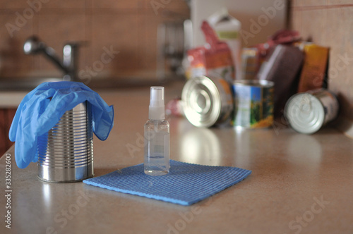 Disinfecting can after receiving products at home. Food home delivery photo