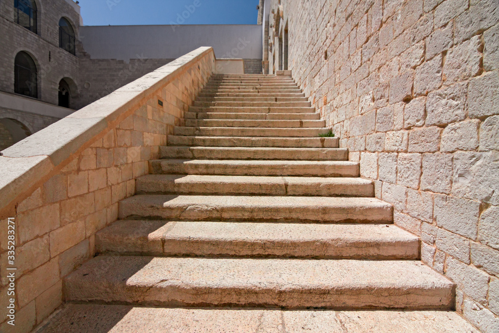 View of the stairs of the medieval castle of Trani in Puglia, Italy.