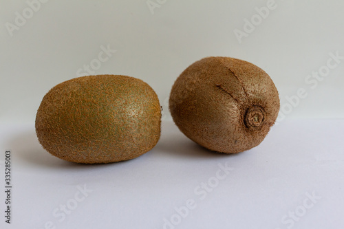Beautiful ripe kiwi fruit on a white background side view and top view.