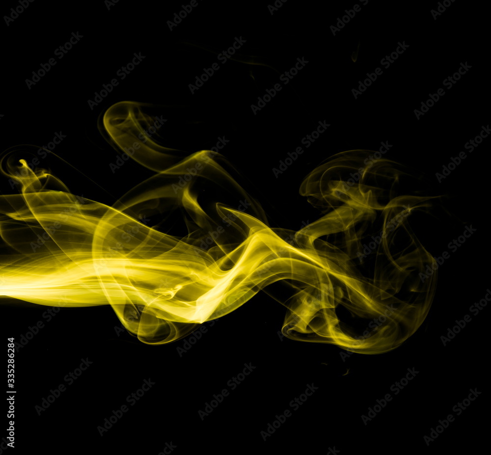 Yellow smoke on black background Yellow smoke on black background