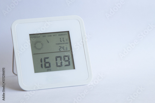 electronic clock thermometer hygrometer on a white background. copyspace for text