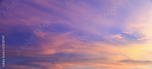 beautiful vivid color fluffy clouds in twilight sky at evening in summer. © tisomboon
