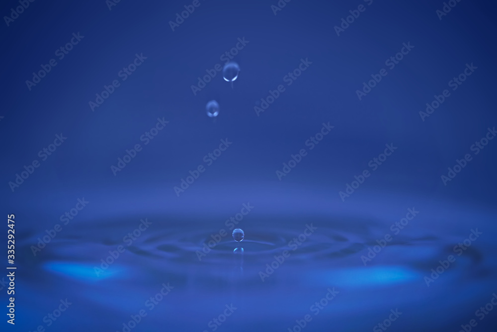 Water splash from falling drop of water wave from side view Water splash from falling drop of water wave from side view