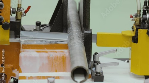 Pipe cutting on a machine at a factory in Russia