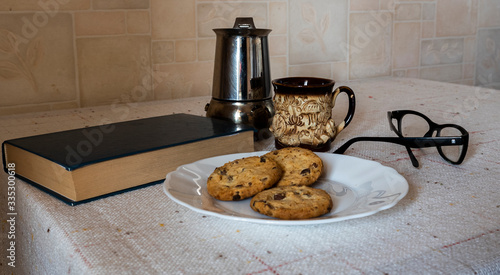 reading a book with coffee and cookies