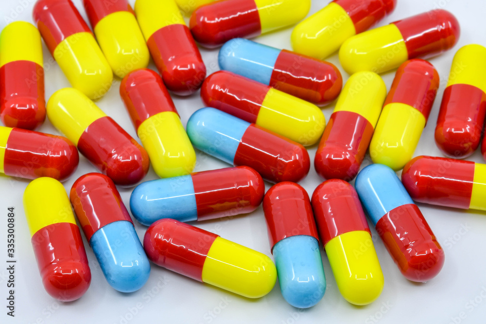 Close up view of coloured capsules of cold and flu medication Close up view of coloured capsules of cold and flu medication