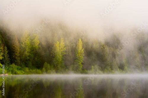 Early Morning Fog Rising Over Lake