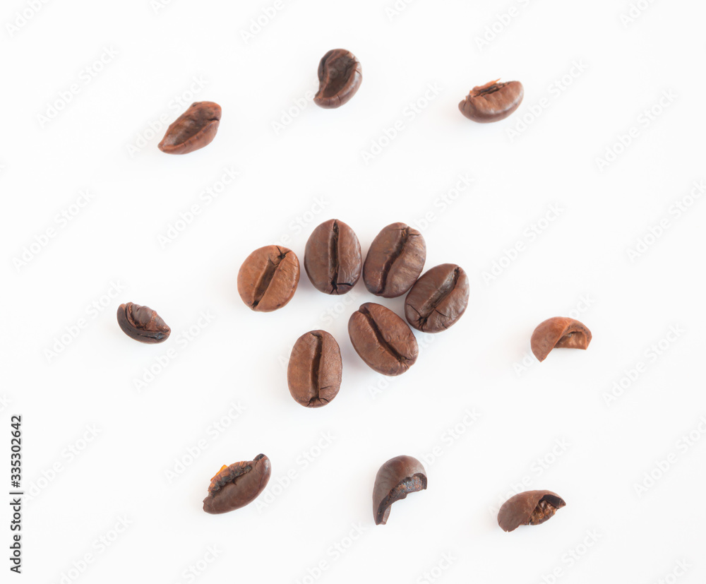 Close up organic Coffee beans isolated on white background.