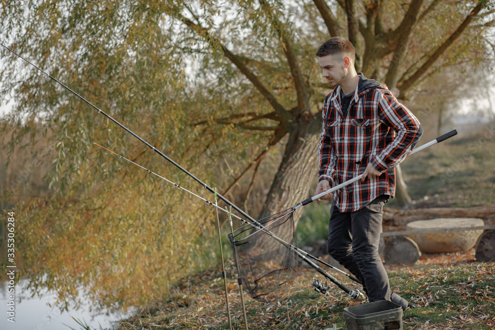 Man by the river. Guy in a red shirt. Man in a fishing. Man by the river. Guy in a red shirt. Man in a fishing.