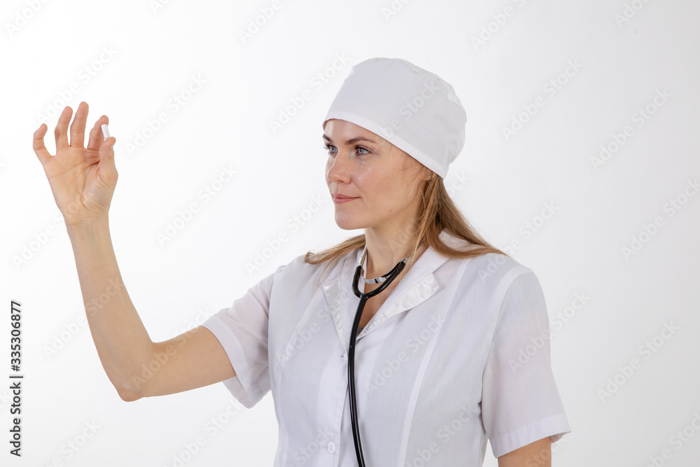 A doctor in a white coat looks at the medication. A doctor in a white coat looks at the medication.