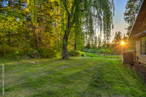 Luxury summer mountain home front and back yard.