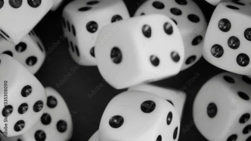 Dice dropping and bouncing in slow motion. Сlose-up.
