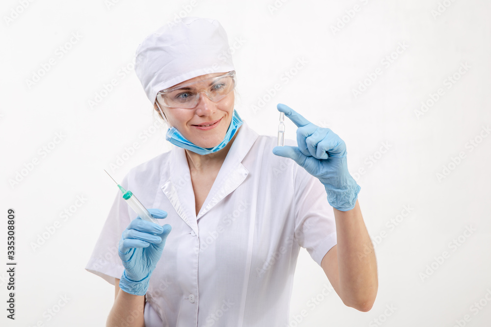 A doctor in a white coat looks at the medication. A doctor in a white coat looks at the medication.