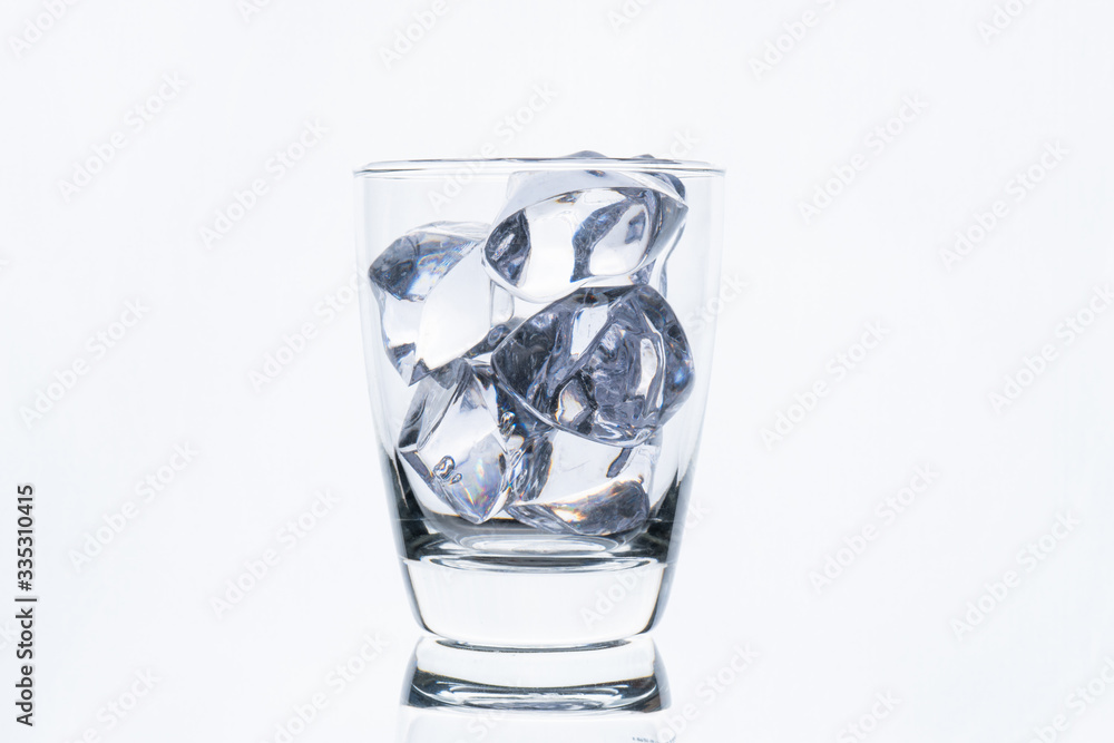 glass with ice cube isolated on white background glass with ice cube isolated on white background