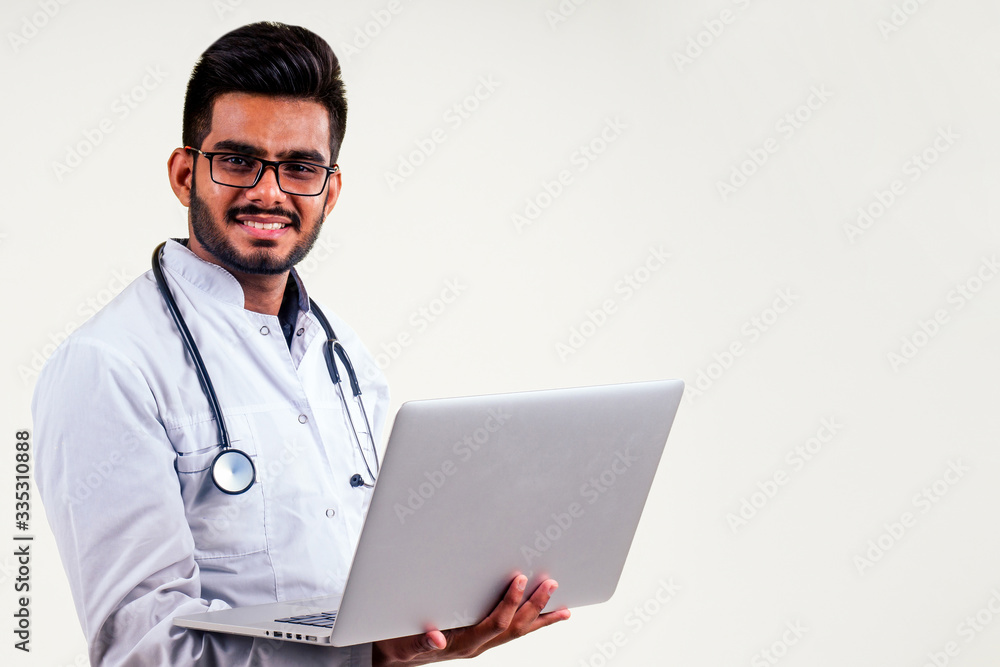 Portrait of indian male doctor checking medicine white isolate studio background.remote freelancing concept Portrait of indian male doctor checking medicine white isolate studio background.remote freelancing concept