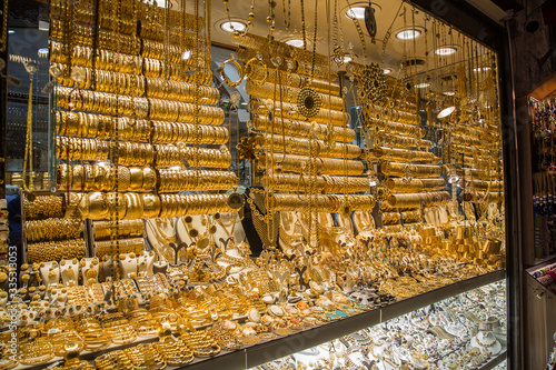 A showcase with a lot of gold jewelry