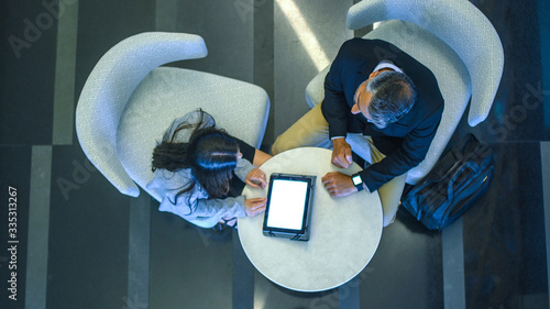 Business meeting and working, man and woman talking in a business metting.
