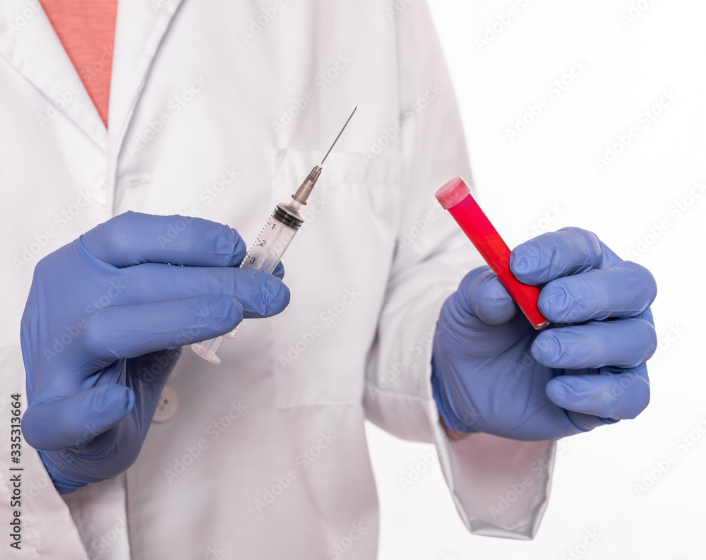 Doctor in mask and gloves holding test tube and syringe with blood over white background Doctor in mask and gloves holding test tube and syringe with blood over white background