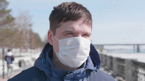 Guy in a protective mask on the street. Prevention and protection of health and life safety. Coronavirus N1H1,covid-19, a pandemic in the world.