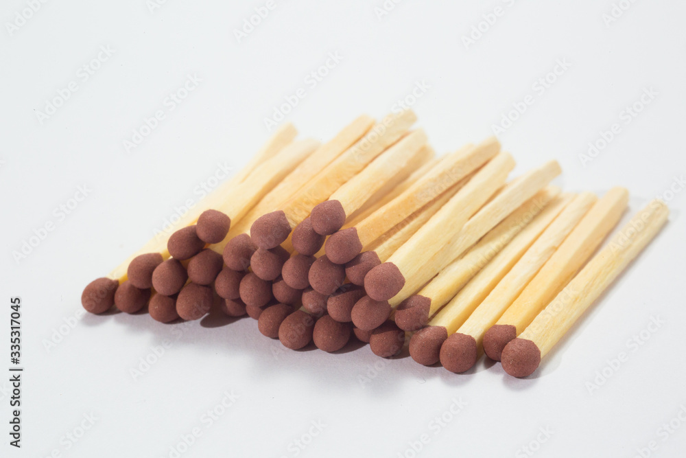 Close-up of a red match isolated on a white. Close-up of a red match isolated on a white.