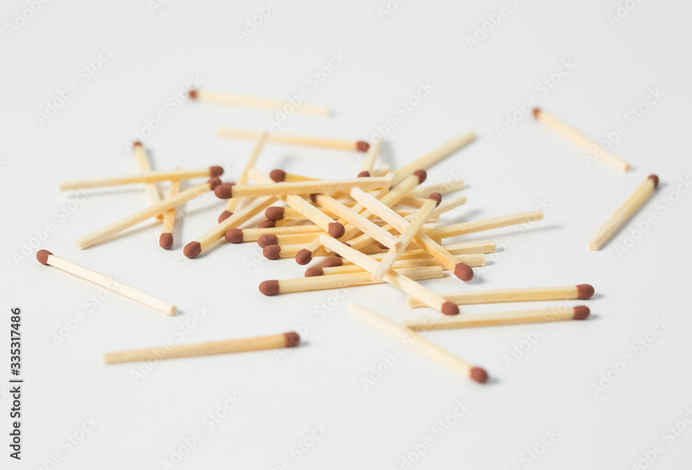 Close-up of a red match isolated on a white. Close-up of a red match isolated on a white.