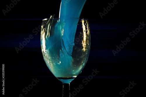 glass of liqueur on a black background