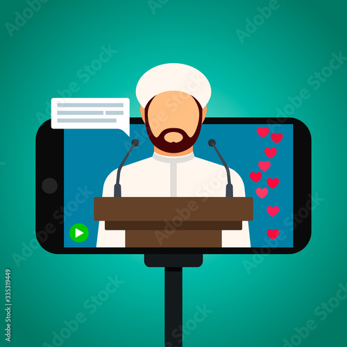 Muslim imam giving a speech in a mosque online. Home worship during quarantine due to the Covid-19 coronavirus.
