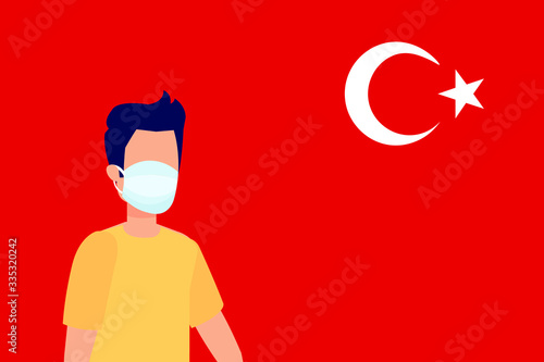 Coronavirus quarantine design for Turkey. Boy wearing health mask for virus and illnesses in front of Turkish flag.