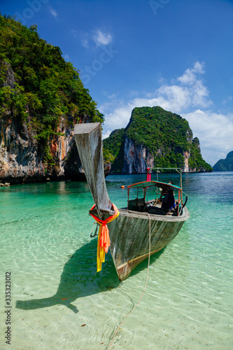 Boat in turquoise water Phi Phi island Thailand