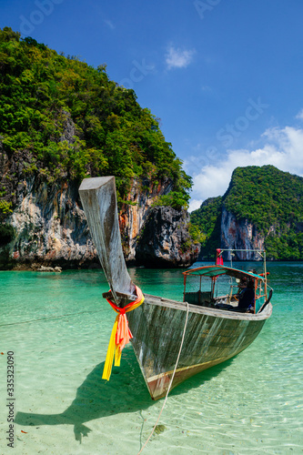 Boat in turquoise water Phi Phi island Thailand