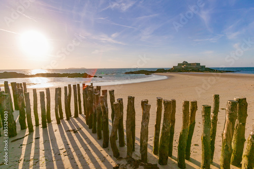 break wave, Ruins of Fortress and beach of Saint Malo at low tide, Brittany, France
