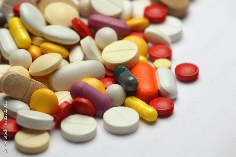 Different colorful tablets at white background Different colorful tablets at white background