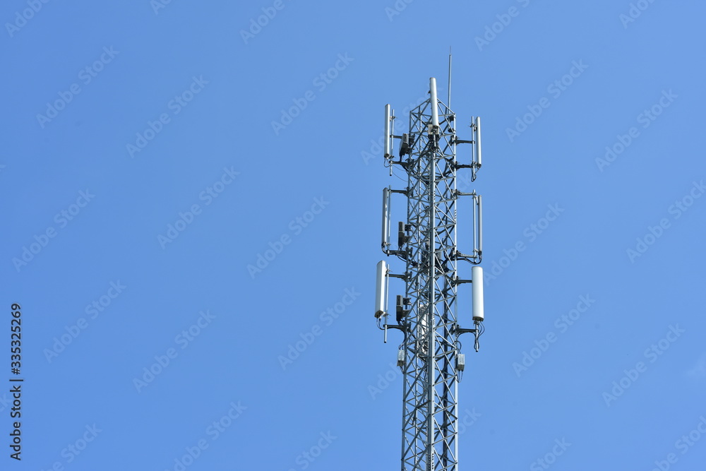 .Wireless Communication Antenna With bright sky.Telecommunication tower with antennas.High pole for signal transmission. .Wireless Communication Antenna With bright sky.Telecommunication tower with antennas.High pole for signal transmission.