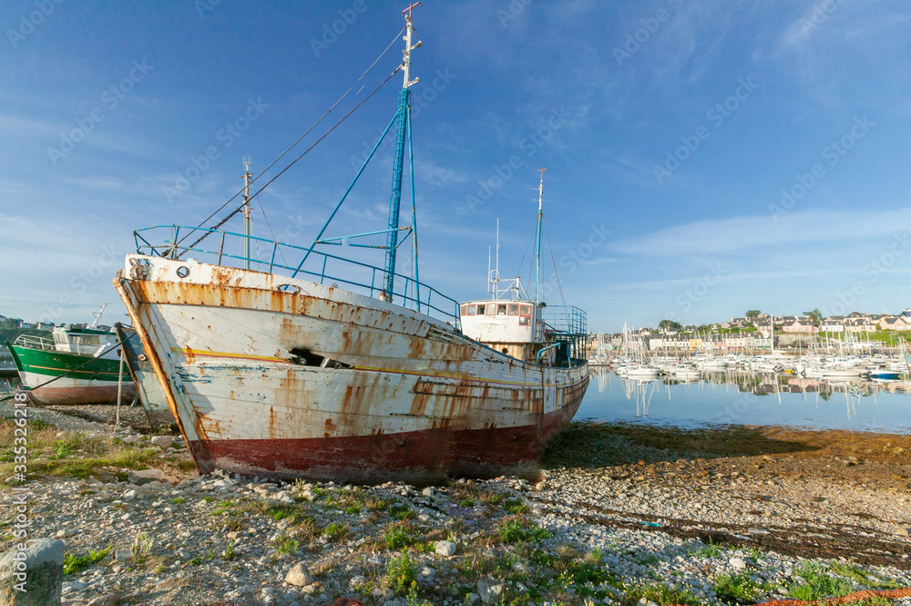 rotten fishing vessels on the beach of the pitouresk breton village of Camaret sur mer