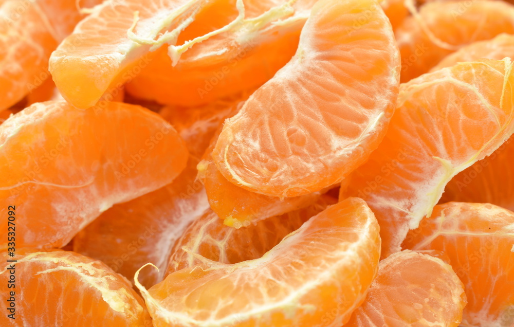 tangerine orange peel out and piece on wooden table