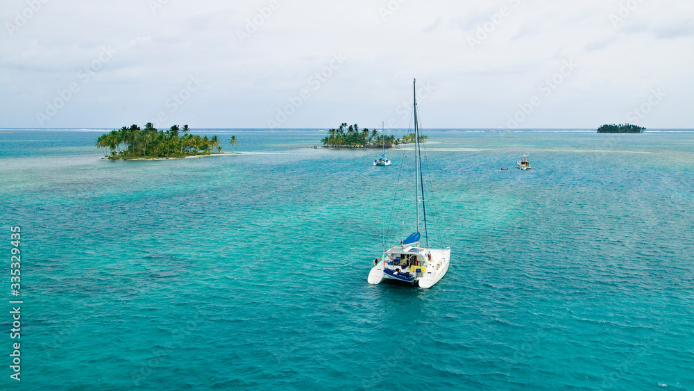 sailing yachts at anchor in the turquoise colored waters of the San Blas Islands, Kuna Yala, Panama