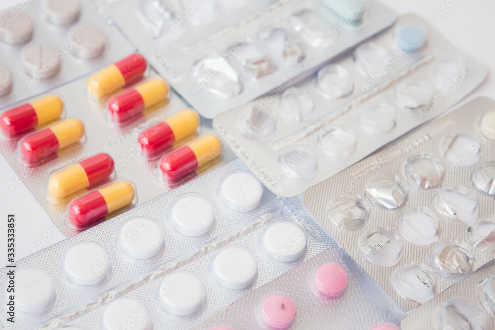 Medical pills on white background. Top view. Mock up. Flat lay composition Medical pills on white background. Top view. Mock up. Flat lay composition
