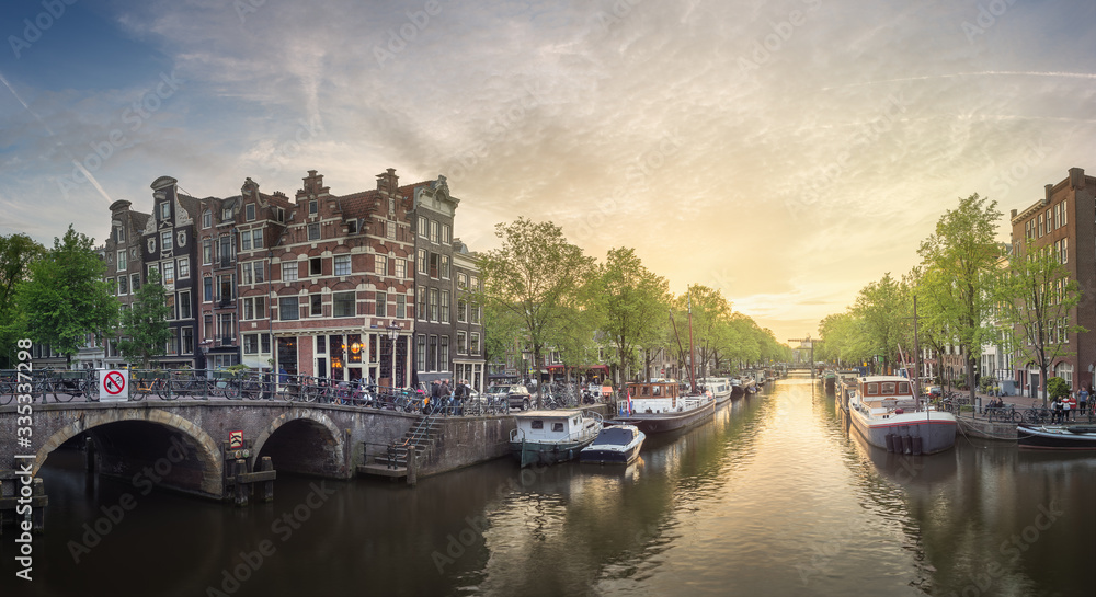 River, traditional old houses and boats, Amsterdam