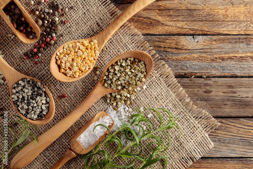 Various raw lentils with rosemary  salt and pepper.