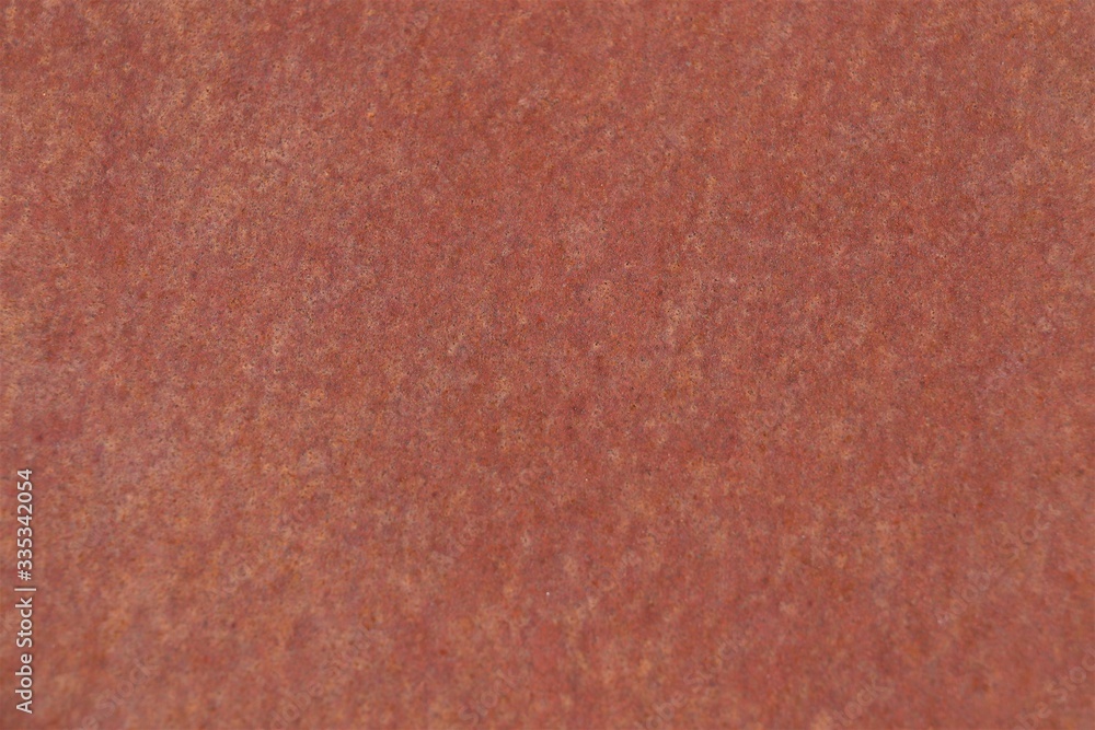 Marble surface in burgundy color.