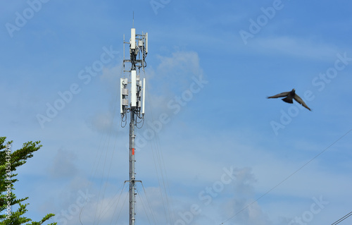 .Wireless Communication Antenna With bright sky.Telecommunication tower with antennas.High pole for signal transmission. There are both wireless phone systems and microwave systems. 