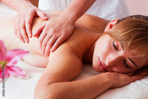 Massage and body care. Spa body massage woman hands treatment. Woman having massage in the spa salon
