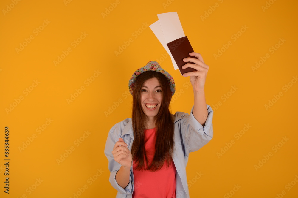 a woman holding a passport and plane tickets trip vacation a woman holding a passport and plane tickets trip vacation