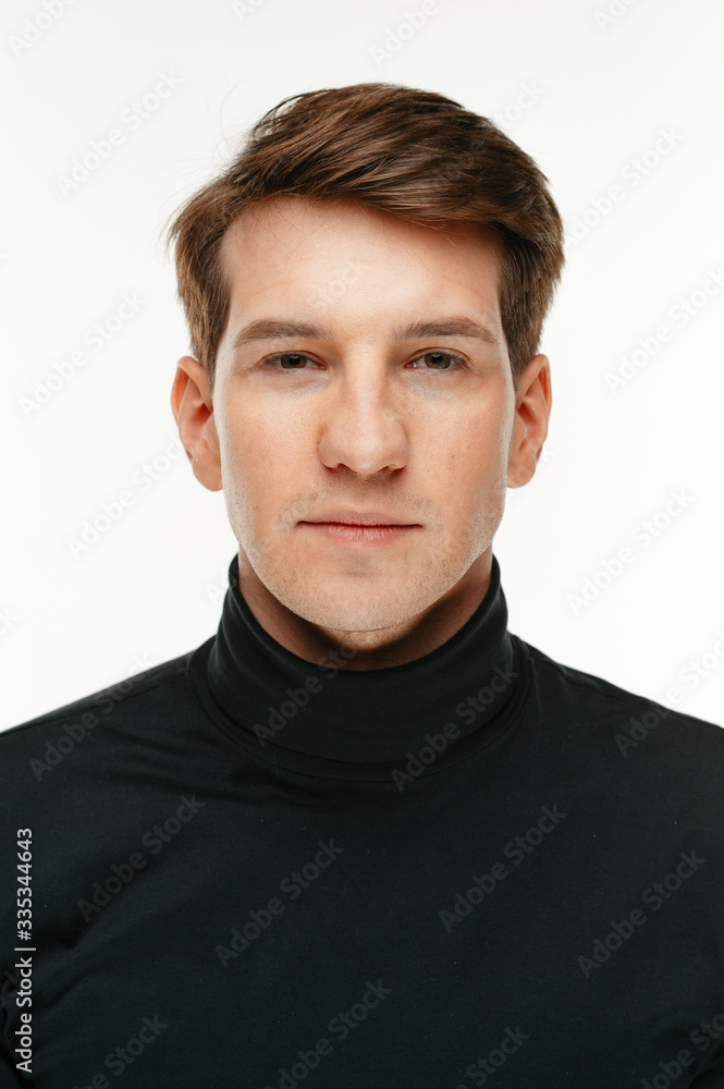 Fototapeta premium young man wearing turtleneck on white studio background