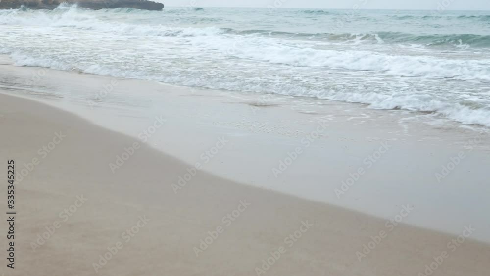 Deserted beach landscape with waves breaking on the shore. Deserted beach landscape with waves breaking on the shore.