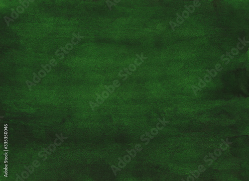 Watercolor deep green background painting. Aquarelle calm grass green color backdrop. Stains on paper hand painted texture.