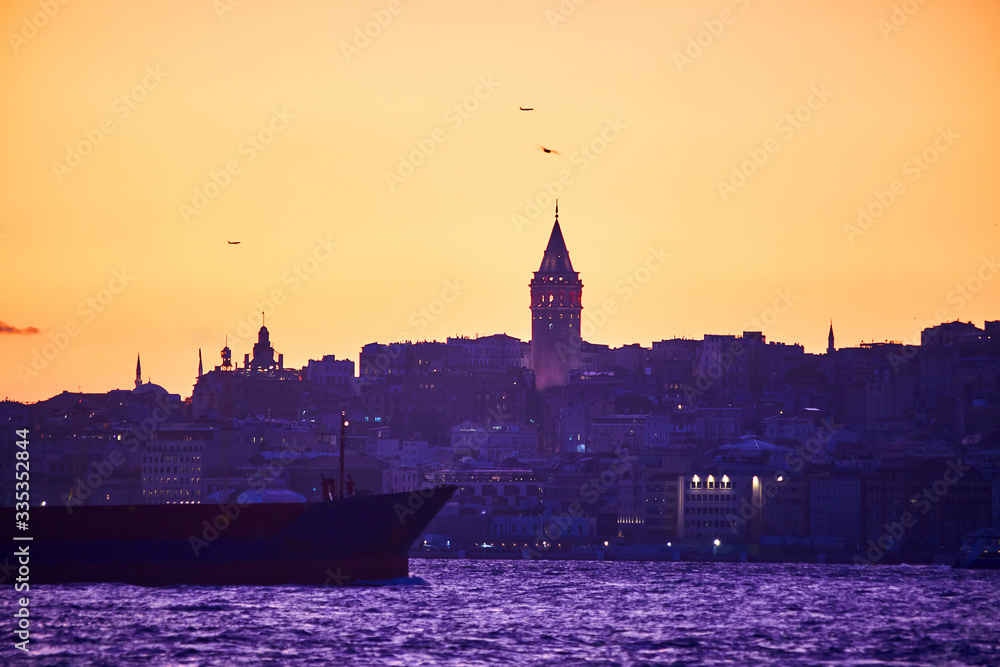 Fototapeta premium Istanbul cityscape in Turkey with Galata Kulesi Tower. Ancient Turkish famous landmark in Beyoglu district, European side of city. Architecture of the Constantinople.Historical place made by Genoese