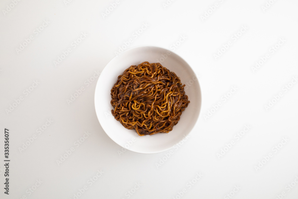 black bean sauce noodles in a White Bowl.
Korean name Jjapaguri. black bean sauce noodles in a White Bowl.
Korean name Jjapaguri.