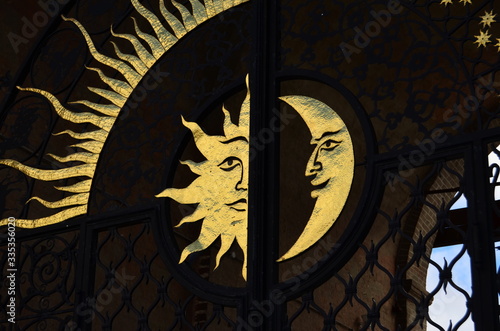 forged image of the sun and moon on the fence