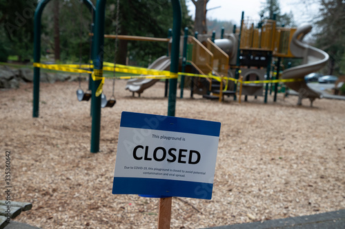 Playground closed with caution tape due to virus in Washington State.